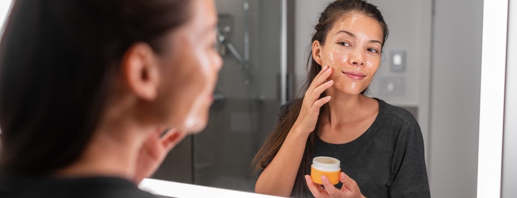 Woman applying mask
